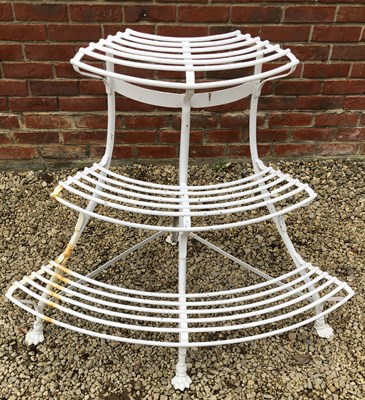 Lot 543 - A white painted wrought iron corner auricular theatre or plant stand