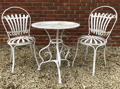 Lot 512 - A white painted wrought iron bistro set