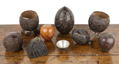 Lot 200 - Group of carved coconut cups and related...