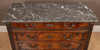 Lot 78 - An 18th century style Irish mahogany chest of drawers with a marble top in the Chippendale style