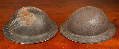Lot 6 - Two old tin helmets