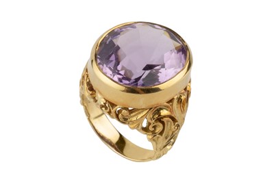 Lot 153 - An amethyst single stone dress ring, the oval...