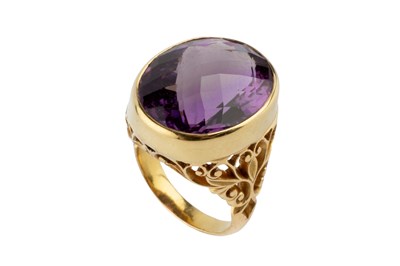 Lot 155 - An amethyst single stone dress ring, the oval...