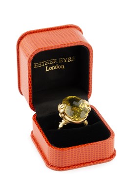 Lot 154 - A yellow quartz single stone dress ring by...