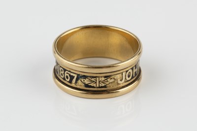 Lot 33 - A 19th century enamel memorial band ring, with...