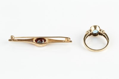 Lot 274 - A gem set dress ring, the oval cabochon blue...