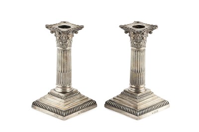 Lot 698 - A pair of Edwardian silver candlesticks, of...