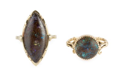 Lot 150 - Two boulder opal dress rings, the first with a...