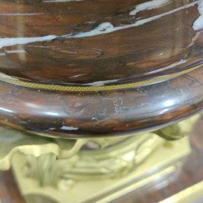 Lot 158 - A pair of French Empire style rouge marble lidded urns