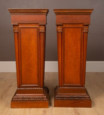 Lot 360 - A pair of classically modelled square plinths