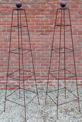 Lot 518 - A pair of prism garden obelisks