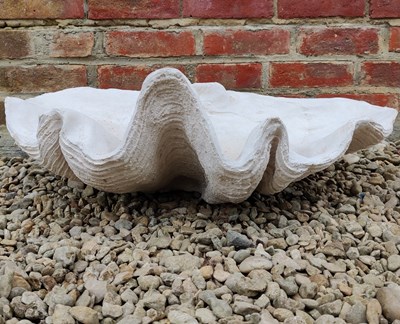 Lot 534 - A cast composite giant clam shell