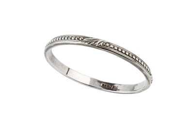 Lot 135 - A silver slave bangle by the Guild of...