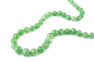 Lot 164 - A jade bead necklace, designed as a continuous...