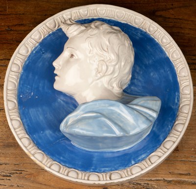 Lot 145 - A pair of Majolica roundels after Cantagali Della Robbia