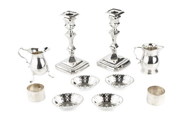 Lot 700 - A pair of George V silver candle sticks, with...