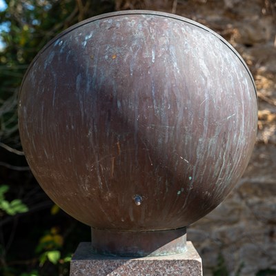 Lot 587 - A Scaphe style copper sundial on a granite plinth