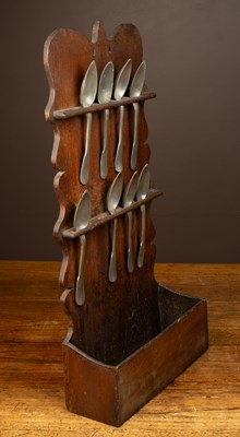 Lot 312 - An antique oak hanging spoon rack