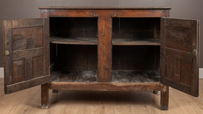 Lot 59 - An 18th century and later oak panelled Welsh housekeeper's cupboard