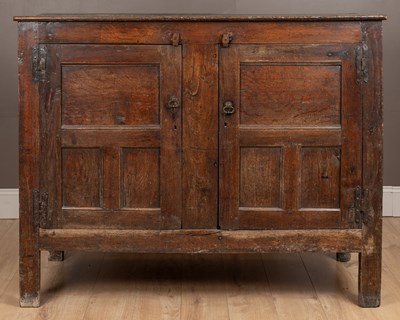 Lot 59 - An 18th century and later oak panelled Welsh housekeeper's cupboard