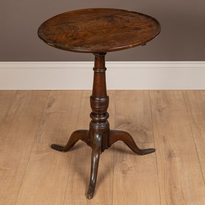 Lot 107 - An 18th century oak circular top tripod table