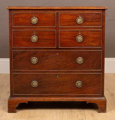 Lot 202 - A George III mahogany commode styled as a chest of drawers