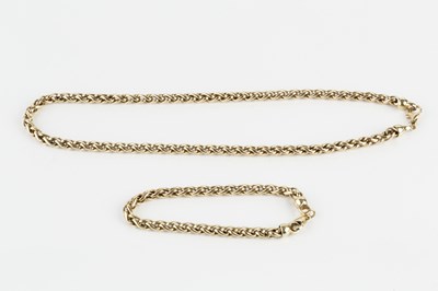 Lot 194 - A 9ct gold chain and bracelet suite, of...
