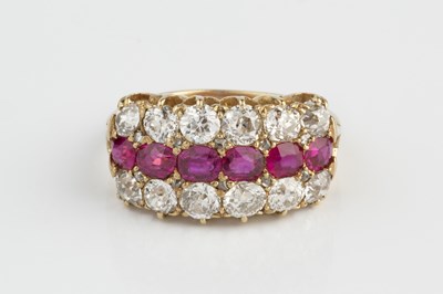 Lot 116 - A ruby and diamond half hoop ring, centred...