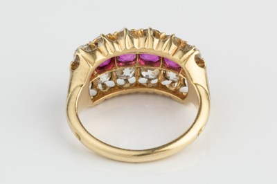Lot 116 - A ruby and diamond half hoop ring, centred...