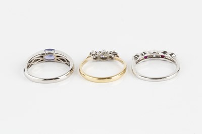 Lot 198 - A diamond three stone ring, the round...
