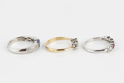 Lot 198 - A diamond three stone ring, the round...