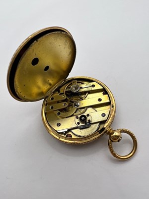 Lot 224 - An open face fob watch, the floral engraved...