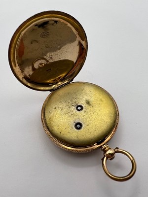 Lot 224 - An open face fob watch, the floral engraved...