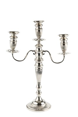 Lot 714 - A George V silver three light candelabrum, the...