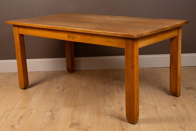 Lot 136 - A modern pale oak kitchen table, together with six pine chairs