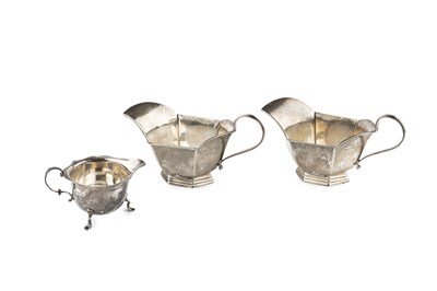 Lot 674 - A pair of George V silver sauce boats, with...