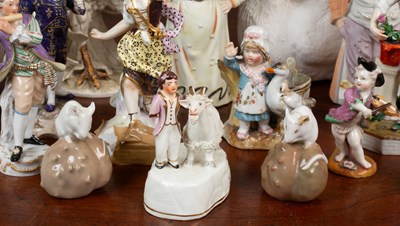 Lot 391 - A collection of porcelain figurines and other pottery