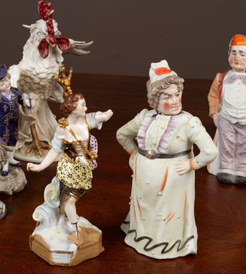Lot 391 - A collection of porcelain figurines and other pottery