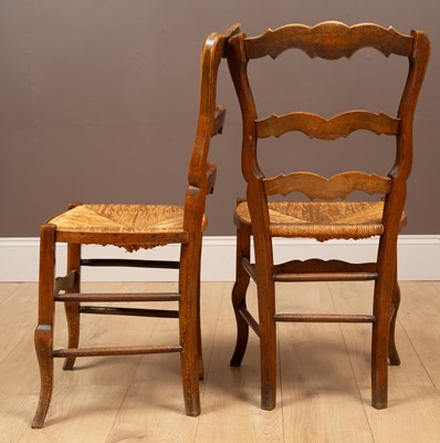 Lot 107 - A set of eight fruitwood farmhouse chairs
