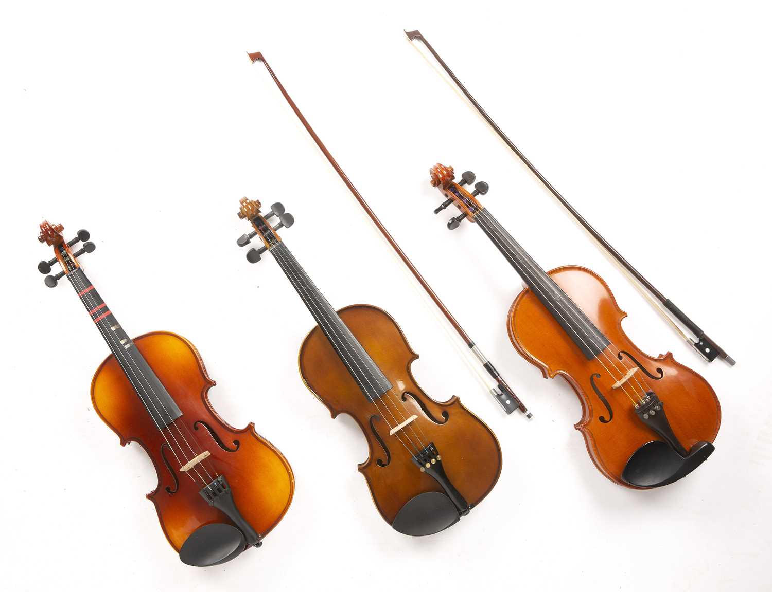Lot 559 - A collection of six modern violins, various...