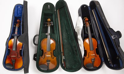 Lot 559 - A collection of six modern violins, various...