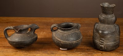 Lot 139 - Three possibly South American pottery vessels, one figural