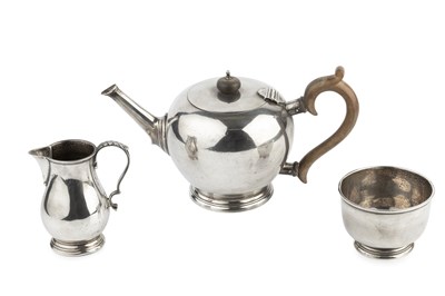 Lot 706 - A silver three piece tea service, of plain...