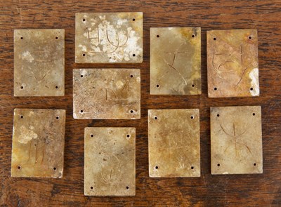 Lot 242 - Nine rectangular hardstone armour mounts...