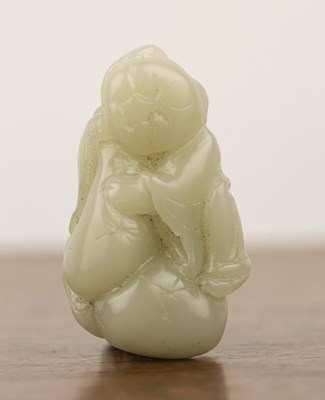 Lot 233 - Pale green jade carving of a boy Chinese, late...