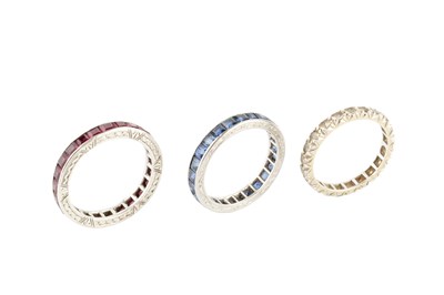 Lot 269 - A sapphire full hoop eternity ring, channel...