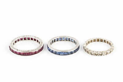 Lot 269 - A sapphire full hoop eternity ring, channel...