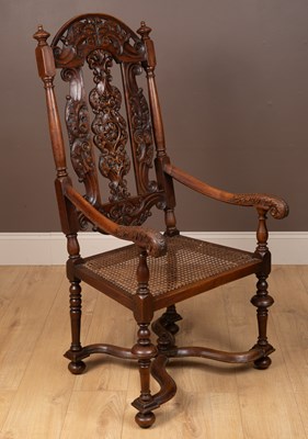 Lot 142 - A 17th century style walnut open armchair