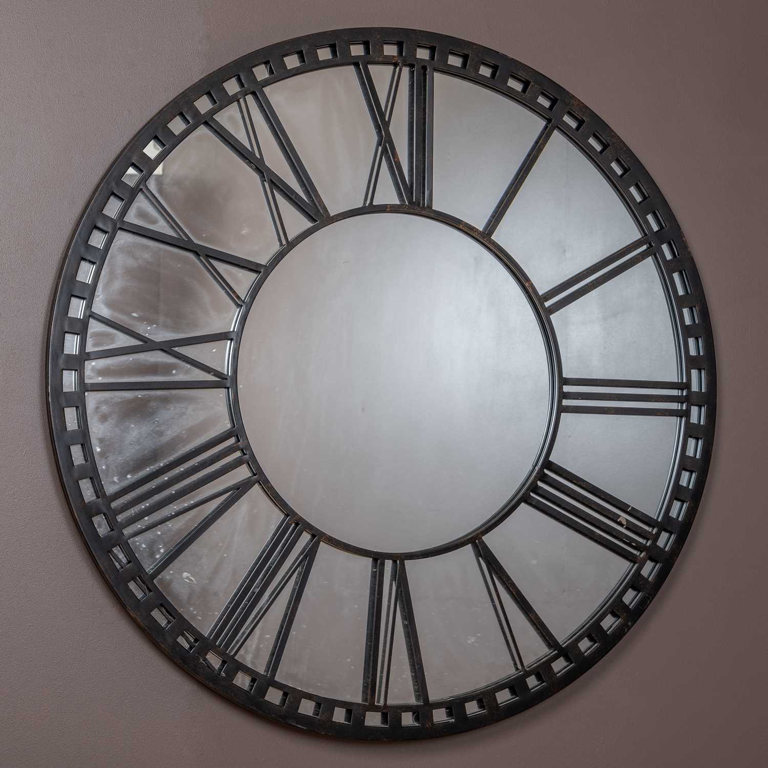 Lot 376 - A circular wall mirror modelled as a clock dial