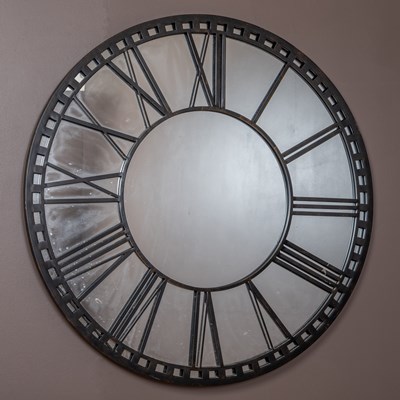 Lot 376 - A circular wall mirror modelled as a clock dial